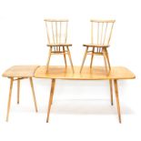 An Ercol light elm rectangular kitchen table, with rounded corners on square tapering legs, a