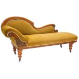 A late 19thC mahogany chaise longue, with a show frame, upholstered in brown draylon on turned