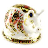 A Royal Crown Derby pig paperweight ornament, gilt stopper, printed marks beneath, 6cm high.