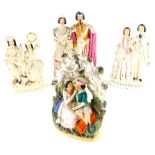Various Staffordshire flatback figures, to include a 19thC musicians group, with bocage base and