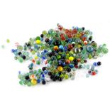 Various marbles, to include swirl examples over coloured, red swirl type large size 2cm diameter,