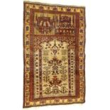 A Persian prayer rug, decorated with stylised tress, flowers, buildings, etc, on a beige ground with