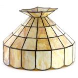 A Tiffany style light shade, of a shaped form, set with milk glass panels, 40cm high.