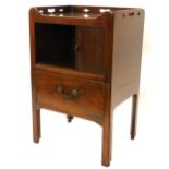 A George III mahogany night commode, the raised gallery with pierced borders and a glass insert,