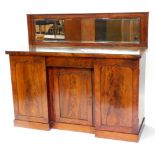 *An early 19thC mahogany sideboard, the raised back with a rectangular bevelled mirror plate, the