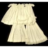 Five christening gowns, one with embroidered collar, 89cm long.