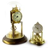 Two brass anniversary clocks, each in a glass dome and column supports, 34cm and 30cm high
