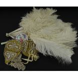 A collection of items, to include an ostrich feather fan, a bead work, wall pocket and a modern