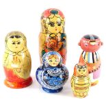 A collection of Russian dolls, various sizes to include a small female doll decorated in blue,