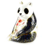 A Royal Crown Derby panda paperweight ornament, gilt stopper, printed marks beneath, 12cm high.