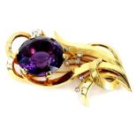 An amethyst and diamond spray brooch, set with single large amethyst 25mm x 15mm, in six claw