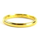 A 22ct gold wedding band, of plain design marked to inside Core Olof FHC Ann, ring size O½, 3.3g all