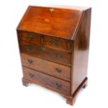 An Edwardian mahogany and boxwood strung bureau, the fall inlaid with a central marquetry fan,