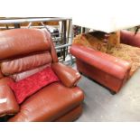 A two piece lounge suite, comprising three seater settee and single armchair, in brown