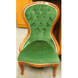 A Victorian style mahogany finish open spoon back chair, with studded back, serpentine seat, and