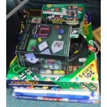 A quantity of games, to include a Casino roulette set, a deluxe poker caddy, other poker elated