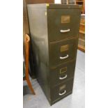 A four drawer metal filing cabinet, 130cm high.
