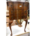 A 20thC walnut drop leaf side table, with shaped drawers each with tier drop handles on cabriole