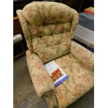 A Celebrity electric reclining armchair, in floral pattern, on cream ground, 100cm high, with