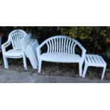 A white plastic patio set, comprising folding chairs, bench, 114cm wide, etc. (a quantity).