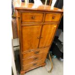 A high quality 20thC cabinet, with herringbone finish crossbanding, two drawers, double cupboards,
