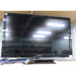 A Panasonic Viera 31 inch LCD TV, with remote and manual.