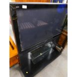 A Panasonic Viera, 41" colour TV in black trim, on stand, with wire and remote control.