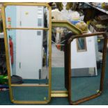 A collection of mirrors, to include a three part over mantel mirror with beval plate, an arched