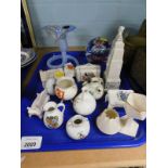 A collection of crested china, to include Old Pete's Cottage near Ramsey, a cricket type bag, an