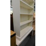 A painted freestanding bookcase, and a similar extending dining table. (2)