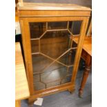A mahogany display cabinet, with astragal glazed door, on shaped feet, with a moulded fix top, 110cm