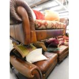 A two piece lounge suite, comprising four seater settee, and three seater settee, each in brown