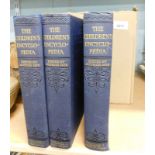 Various volumes of Arthur Mee's Children's Encyclopedia, with blue leather bindings.
