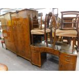 A mid-20thC walnut finish bedroom suite, comprising lady and gentleman wardrobes, mirror back kidney
