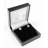 A pair of 18ct white gold diamond stud earrings, each with round brilliant cut diamond, 6.4mm x 6.4m