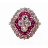 A Victorian style ruby and diamond cluster ring, with four central round brilliant cut diamonds, wit