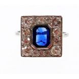 An Art Deco style sapphire and diamond ring, with central octagon cut sapphire, 7.2mm x 5.4mm x 2.4m