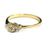 A 9ct gold dress ring, with small tiny diamond set claw design, each stone illusion set on a raised