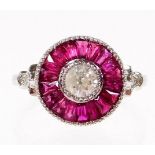A ruby and diamond target ring, set with central old cut diamond 4.2mm x 4.2mm x 3mm, approx 0.50cts