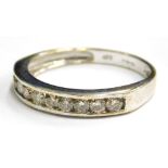 A 9ct white gold half hoop eternity ring, set with various white stones, in channel setting, ring si