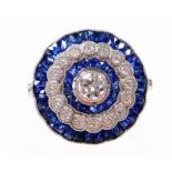 A sapphire and diamond dress ring, with central diamond 4.4mm x 4.4mm x 2.2mm, by calibre cut sapphi