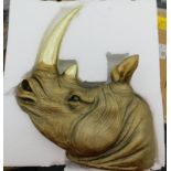 A Bloomsbury Marketm gold rhinoceros head wall decoration, RRP £58.99.