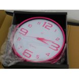 A Symple Stuff pink wall clock, RRP £24.13.