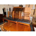 A Remploy stained oak bureau, together with three teak vintage dining chairs with vinyl seats. (4)