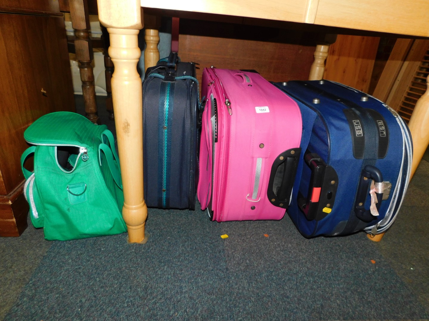 Three suitcases, together with a Carlton overnight bag. (4)