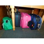 Three suitcases, together with a Carlton overnight bag. (4)