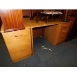 An oak veneered single pedestal desk, 73cm high, 129cm wide, 65cm deep., together with a matching