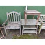 A teak garden chair, together with two garden coffee tables. (3)