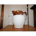 Withdrawn Pre-Sale by Executors. A Staffordshire mid 19thC two tone pottery water jug,
