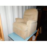 Withdrawn Pre-Sale by Executors. An electric rise and recline armchair, upholstered in beige